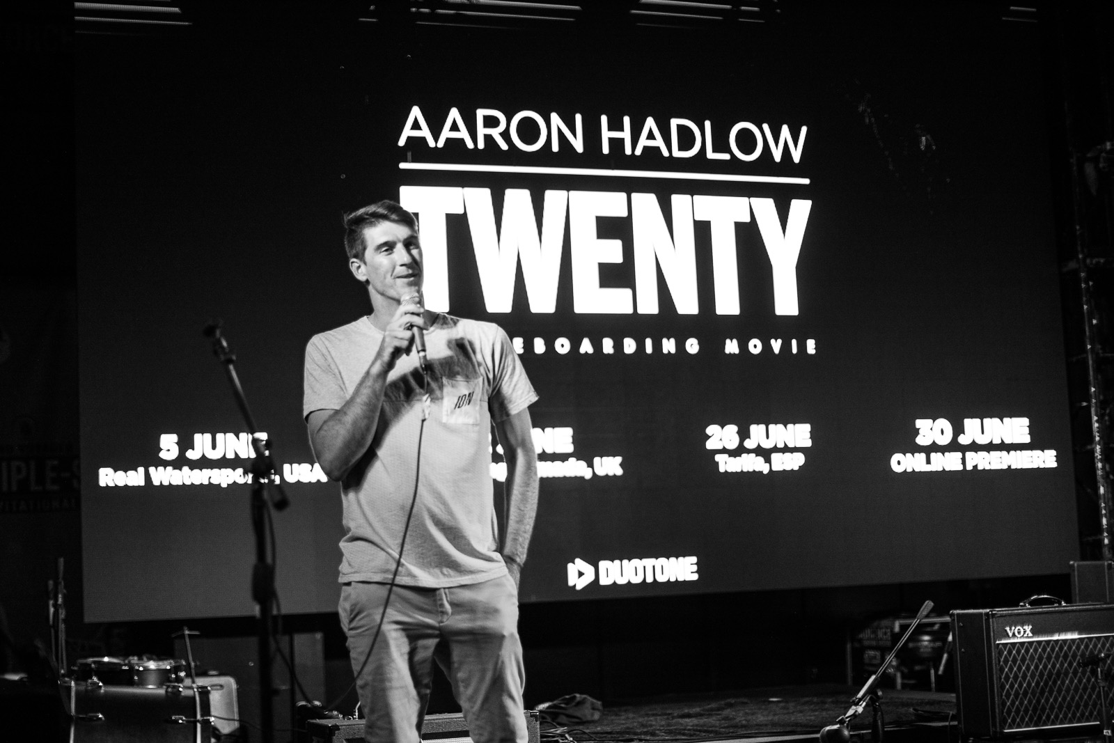 Aaron Hadlow speaking on stage at the Twenty kiteboarding movie premiere